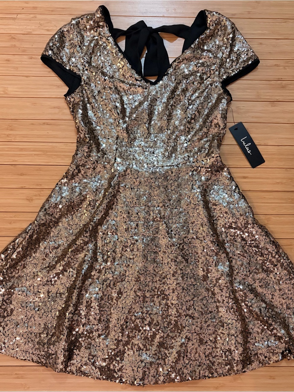 NWT Lulu's Gold Sequin Mini Backless Dress with Black Tie. Size XS